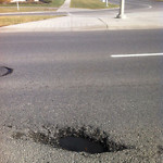 Potholes at 7670–7798 Falconridge Blvd NE