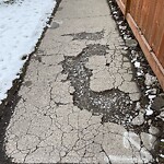 Sidewalk or Curb - Repair at 302 2 Av NE