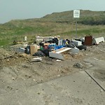 Debris on Street, Sidewalk, Boulevard at 4098 88 Av NE