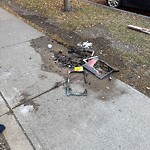 Debris on Street, Sidewalk, Boulevard at 740 15 Av SW