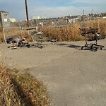 Debris on Street, Sidewalk, Boulevard at 1895 9 Av SW