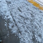 Snow On City - Maintained Sidewalk at 1116 7 Av SW